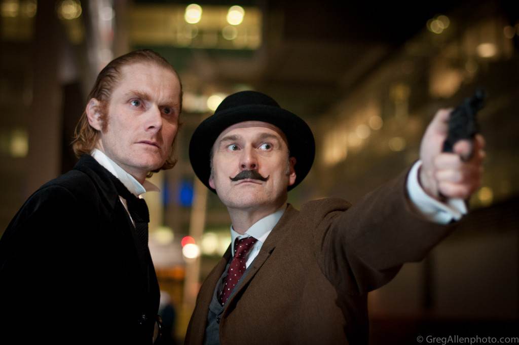Sherlock Holmes and Dr Watson Murder Mystery Actors With Gun